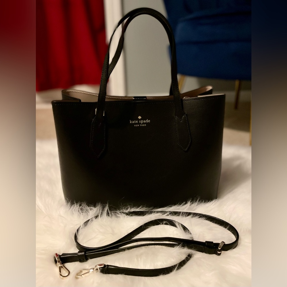 Kate Spade New York. Brand new. Comes with a long leather strap. Size: 12by9in.